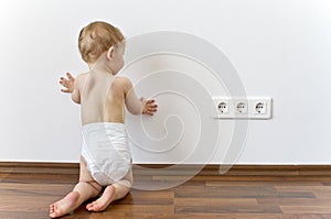 Baby close to electric outlets