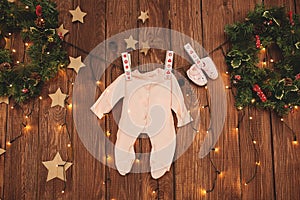 Baby clothes on the clothesline on decorated background