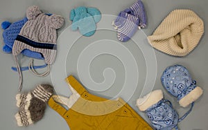 Baby clothes. Flat lay children's clothing and accessories. warm winter clothes, mittens, hats, scarves