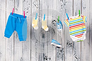 Baby clothes hanging on the clothesline.