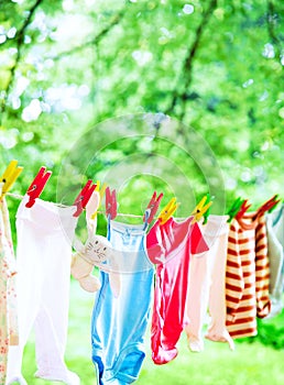 Baby clothes hanging on the clothesline.