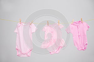 Baby clothes hanging on washing line