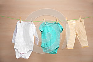 Baby clothes hanging on washing line