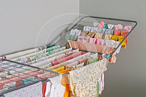 baby clothes to dry after washing, bodysuits, pants, crawlers, t-shirts, wet dries, washing before the birth of the baby