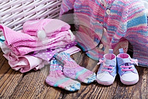 Baby clothes on wooden table