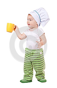 Baby cook in toque with cup