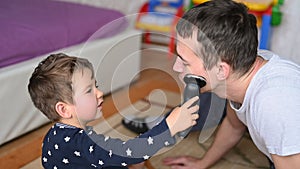 Baby and cordless shavers, father shave photo