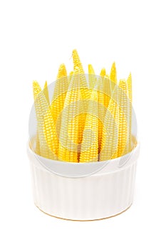 Baby corn in a cup isolated on white background