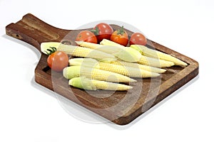 Baby corns on wood plate