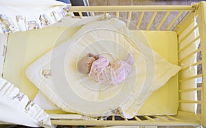 Baby in cot