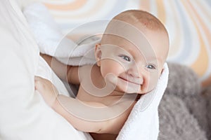 Baby covered with white towel