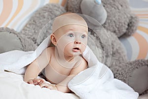 Baby covered with white towel