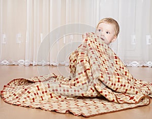 Baby covering with a blanket