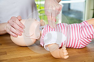 Baby CPR one hand compression photo