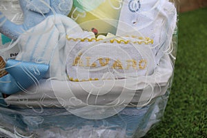 Baby cradle wrapped in a plastic gift bag with a nametag Alvaro on it photo