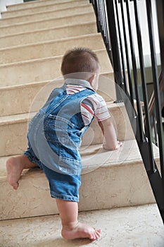 Baby crawling alon on stairs