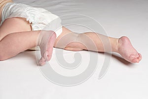 Baby crawling on bed close up of feet