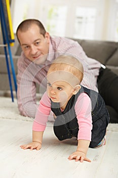 Baby crawling on floor