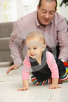 Baby crawling on floor