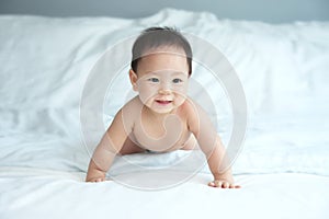 Baby Crawling on Light Blue Blanket