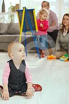 Baby crawling in living room