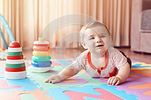 Baby crawling on playmat. Early education development