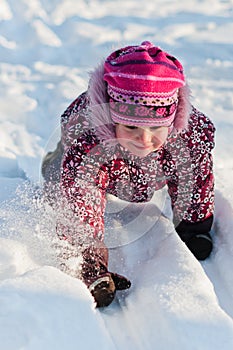 Baby crawls on snow