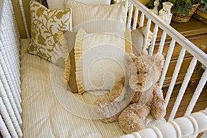 Baby crib and bear.