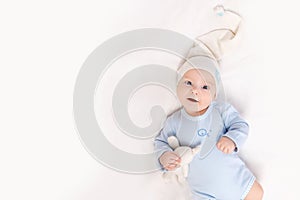 Baby in the crib at home in the morning or before going to bed, portrait, family and birth concept