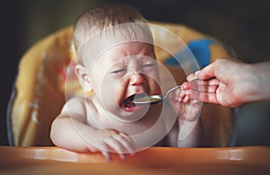Baby cry, capricious, refuse to eat photo