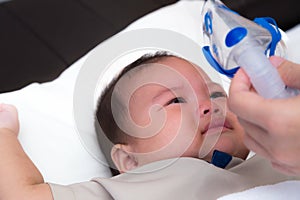 Baby crying and resisting medication