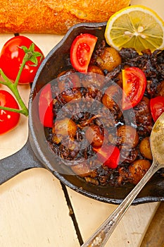 Baby cuttle fish roasted on iron skillet