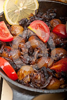 Baby cuttle fish roasted on iron skillet