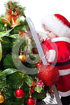 Baby decorating Christmas tree