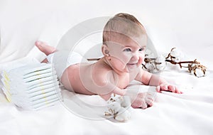 Baby in diaper on a white background