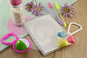 Baby diary with colorful playthings