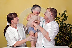 Baby with doctor.