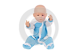 baby doll in blue overalls sits on the pope raising his hands up isolated on a white background