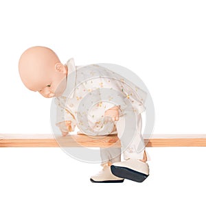 Baby doll on a crossbar