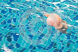 Baby doll floating in a swimming pool, The dangers of children d