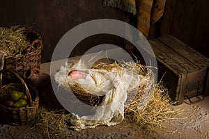 Baby doll in nativity scene