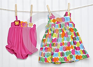 Baby Dress and Bathing Suit on a Clothesline