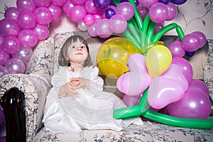 Baby dressed in white dress