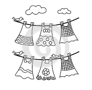 Baby dresses set hanging clothesline