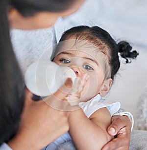 Baby drinking bottle, formula and nutrition with feeding and family, health and growth with early childhood development