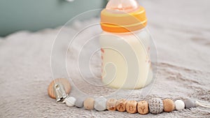 Baby drinking bottle, with milk hypoallergenic adapted infant formula or milk for feeding baby, pacifier clip with