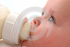 Baby drinking his bottle photo