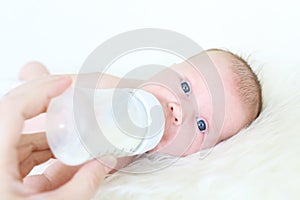 Baby drinking milk from bottle