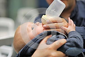 Baby drinking milk from bottle