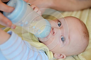 Baby drinking milk from a bottle